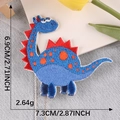 Blue cartoon dinosaur embroidery patch with red fins and orange dots, 7.3cm x 6.9cm size - Blue Dinosaur - Self Adhesive (G3L-B-2-10)