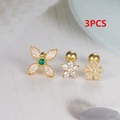 Macro shot of 3pcs gold-plated surgical steel ear studs with zircon flower and star designs - Screw Back / Gold - 3Pcs Set