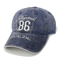 Detailed close-up of vintage blue denim baseball cap with 86 Gorgeous white embroidery - Navy Blue