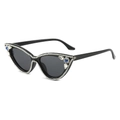 Occhiali da sole cat-eye con montatura nera, strass e cristalli blu su sfondo bianco - Montatura Nera Lenti Grigie