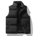 Men's black quilted puffer vest with stand collar and zipper closure on white background - M / Black