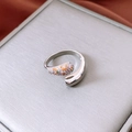 Macro shot of silver-tone hollow butterfly ring with multicolor zircons on grey box - Silver Multi-Color Asymmetric Style (27#)
