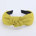 Detail of a mustard yellow knotted wide headband with high-quality twill fabric texture - Yellow