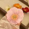 Pink silk floral hair clip with yellow center and delicate lace sleeve detail - Pink Poppy