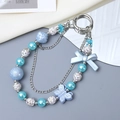 Blue and white beaded phone charm with heart bow pendants and double silver chains - Charm / Blue