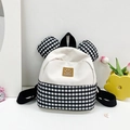 Mini kids backpack featuring black and white checkerboard pattern with cute 3D round ears - Black