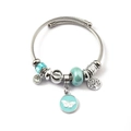 Close-up of steel twisted cable bracelet with turquoise crystal and tree of life charm - Life Tree Butterfly (C1-018) / Blue