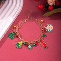 Christmas charm bracelet with snowman, tree and bell pendants on a gold chain - D1149 (Merry Christmas Tag)