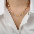 Two-tone gold and silver bamboo link necklace with geometric textures on white shirt - Engraved Version / Gold and Steel Mixed