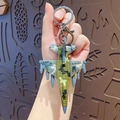 Mini gevechtsvliegtuig model sleutelhanger met groene camouflage en metalen ring - F16 Gevechtsvliegtuig Hanger-USA-Groen Camouflage
