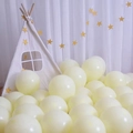 Light yellow Macaron round latex balloons scattered near a white play tent for party decor - Special Price Drop - 10-inch Medium Balloons (22 Pieces) Macaron Yellow - A Must-have Choice