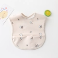 Waterproof baby feeding bib in powder pink with cotton print and front food pocket - Pu No-wash Bib - Little Cotton / One Size
