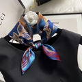 Blue silk scarf with golden leaf and red stripe patterns tied in a bow on a black top - 70*70cm / 30117-Blue Golden Leaves
