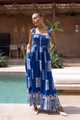 Detail of blue and white floral print on a smocked waist maxi dress with pool background - Blue Square Pattern
