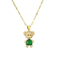 Gold bear pendant necklace featuring green pear-shaped zircon and white stones - Green Heart