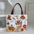 Mini cream canvas tote bag with cute capybara print and brown handles for daily use - Happy Capybara-White