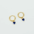Elegant gold earrings with heart-shaped blue stones and zircon inlay on white background - Sapphire Blue