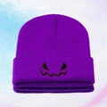 Purple knitted beanie with Halloween pumpkin face embroidery and ribbed fold-over cuff - Deep purple