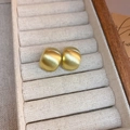 Detailed view of matte brushed gold curved earrings in a luxury wooden jewelry box - Gold (925 Sterling Silver Pin)