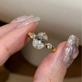 Luxury oval cut three-stone gold ring featuring a sparkling central gemstone and side accents - J5720-Gold Oval Three Stone