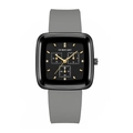 Macro detail of square black quartz watch face with gold markers and grey silicone strap - Gray