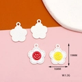 Detail view of 19mm white matte daisy charms with smiley faces and non-slip back texture - Red Smiling Flower