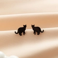 Minimalist black cat silhouette stainless steel stud earrings on satin background - Cat Black