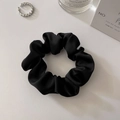 Detailed view of a soft black satin scrunchie with elegant silk gloss on white background - Small Black (approx. 8CM)