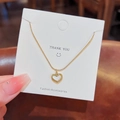 Golden titanium heart necklace with white mother of pearl inlay on gift display card - X342 White Heart