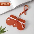 Orange lychee grain leather glasses case with gold rivet closure and hanging strap - Orange