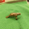 Vintage brass manatee miniature figurine with detailed texture for office desk decor - Manatee Shape / Manatee Shape