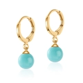 Detail of gold hoop earrings with turquoise round bead pendants on a white background - Sky Blue