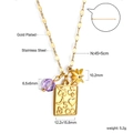 Detail of gold-plated stainless steel necklace with star, bead, and engraved rectangle pendant - Multi-Pendant Rectangular Tag