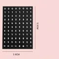 Sheet of 88 black round stickers with white numbers and symbols, size 5.5cm x 3.9cm - Black Background Number Stickers