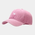Close-up of pink washed cotton baseball cap with white polar bear embroidery detail - Pink