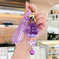 Purple oil-filled floating wind chime keychain with rubber strap and butterfly charm - Oil-filled Flower - Purple