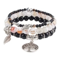 Detail of tree of life and feather charms on bohemian multi-layer beaded bracelets - Black Agate