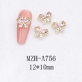 Detailed macro view of gold alloy butterfly nail art charms with pink rhinestones - Pink Butterfly with Gold Base (A756)