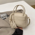 Cream hand-woven crossbody bag with tassel and adjustable gold hardware strap - White