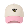 Close-up of the detailed bee embroidery on a color-block five-panel cotton baseball cap - Pink