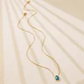 Detail of gold chain necklace with a water drop blue gemstone pendant and lobster clasp - Deep Blue Teardrop Style (BD024-blue)