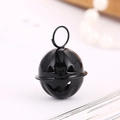 Glossy black metal Halloween pumpkin bell with hollow face design and top loop hook - 24mm / Painted Black