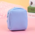Detail of light blue mini backpack coin purse with cross-grain texture and zipper - Blue