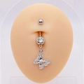 Macro detail of a silver butterfly navel ring with inlaid rhinestones on a skin model - Exquisite Rhinestone Butterfly
