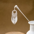 Detailed view of a silver tassel hairpin with hollow geometry in a white ceramic vase - Hollow Circular Ring Tassel (F368)