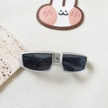 Macro view of silver Y2K futuristic sunglasses for kids with deep gray lenses - Silver Grey