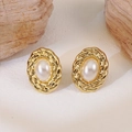 Vintage oval gold earrings with twisted rope border and white faux pearl center - White