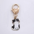Cute black and white cat charm keychain with gold heart-shaped ring for bags - Cute Cat Cow Pattern
