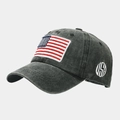 Detail view of washed cotton fabric and USA flag embroidery on a dark grey baseball cap - Army Green