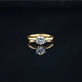 Classic gold titanium steel ring with moissanite in a four-prong setting and reflection - US 5 / Gold